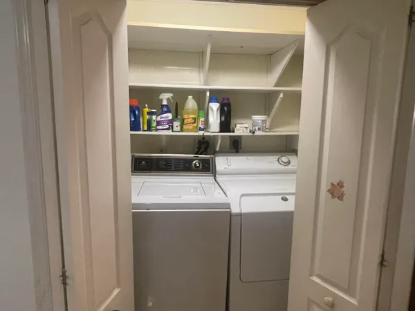 a view of a livingroom with a kitchen