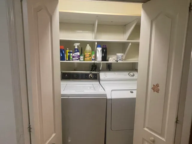 a view of a livingroom with a kitchen