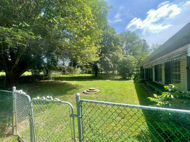 a view of a golf course with a lake view