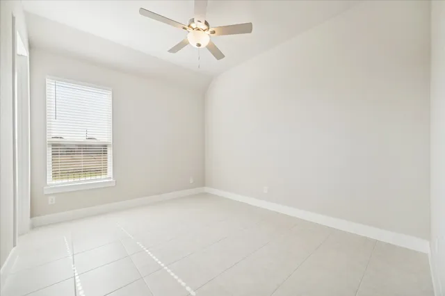 a bathroom with a sink a toilet and a large mirror