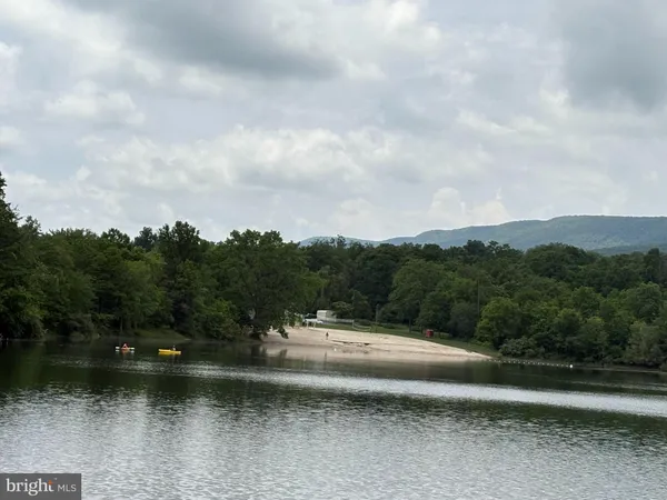 a view of a lake view with houses in back