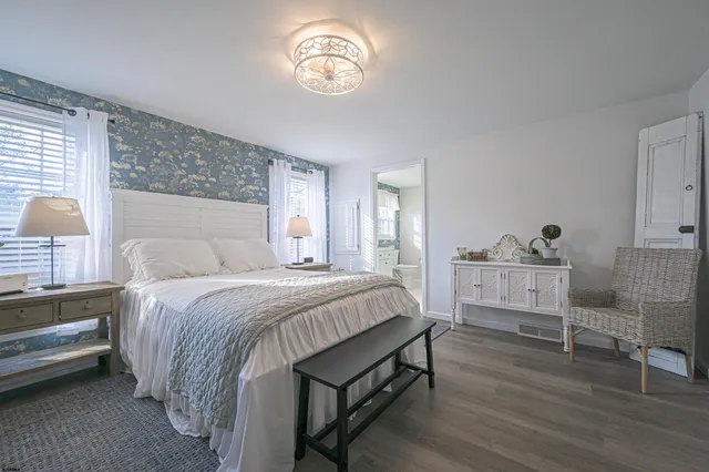 a bedroom with a bed and a table in it