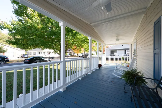 a view of a porch with wooden floor and outdoor space