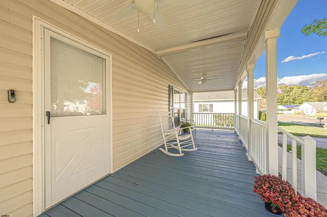 a view of a balcony with wooden floor