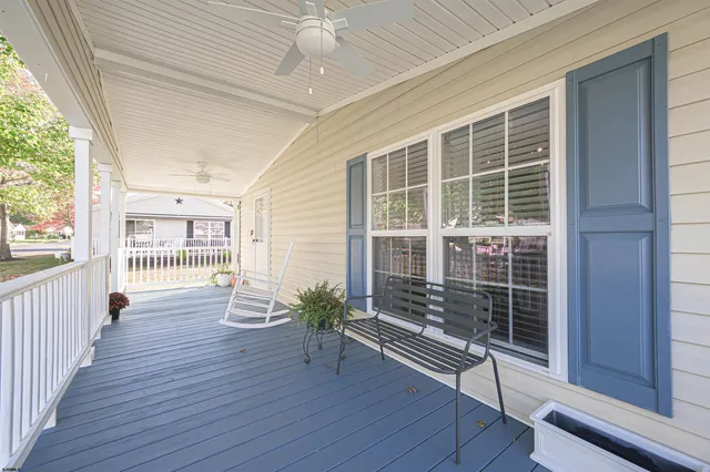 a room with wooden floor and windows