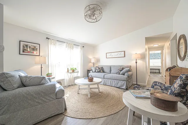 a living room with furniture and a table