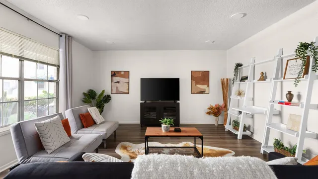 a living room with furniture fireplace and a flat screen tv