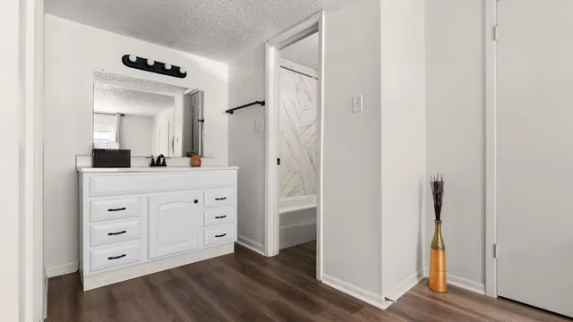 a bathroom with a double vanity sink and mirror