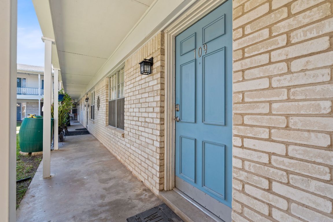 8730 North Mopac Expressway, Unit 109 Austin, TX 78759 - Photo 20 of 21 a view of a house with a door and wooden walls