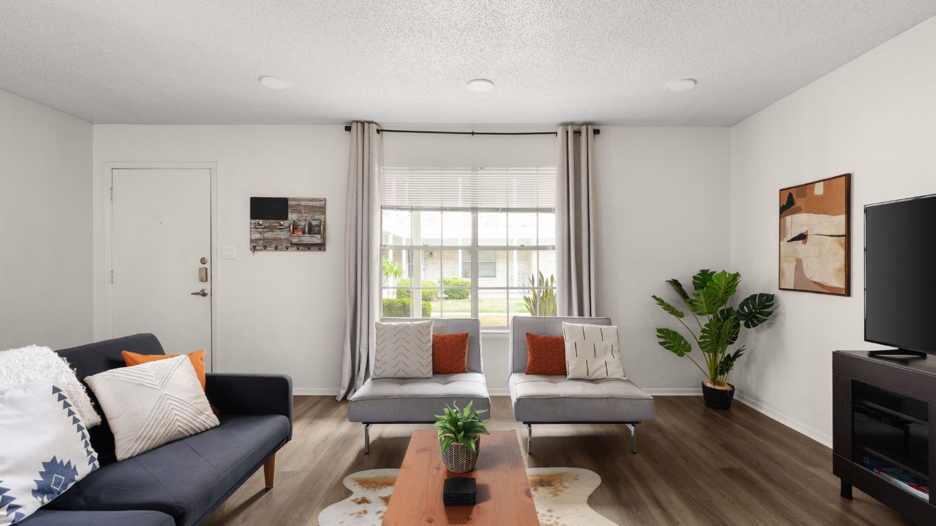 8730 North Mopac Expressway, Unit 109 Austin, TX 78759 - Photo 3 of 21 a living room with furniture and a potted plant