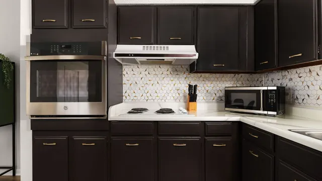 a kitchen with a sink and cabinets