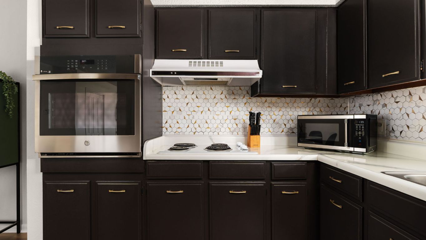 8730 North Mopac Expressway, Unit 109 Austin, TX 78759 - Photo 7 of 21 a kitchen with a sink and cabinets