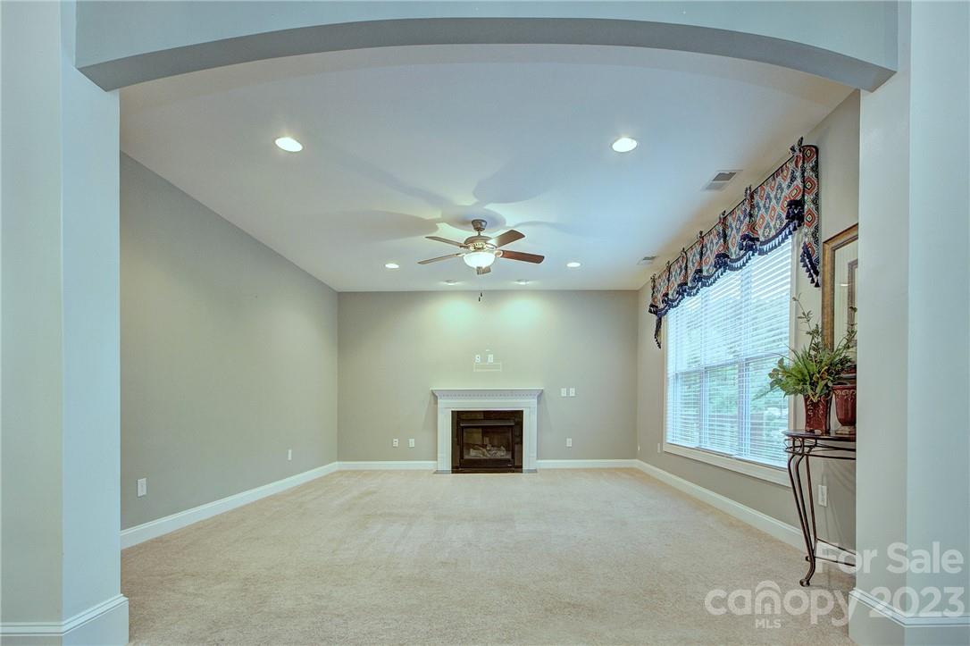 160 Kentmere Lane Clover, SC 29710 - Photo 15 of 37 en empty room with windows and ceiling fan