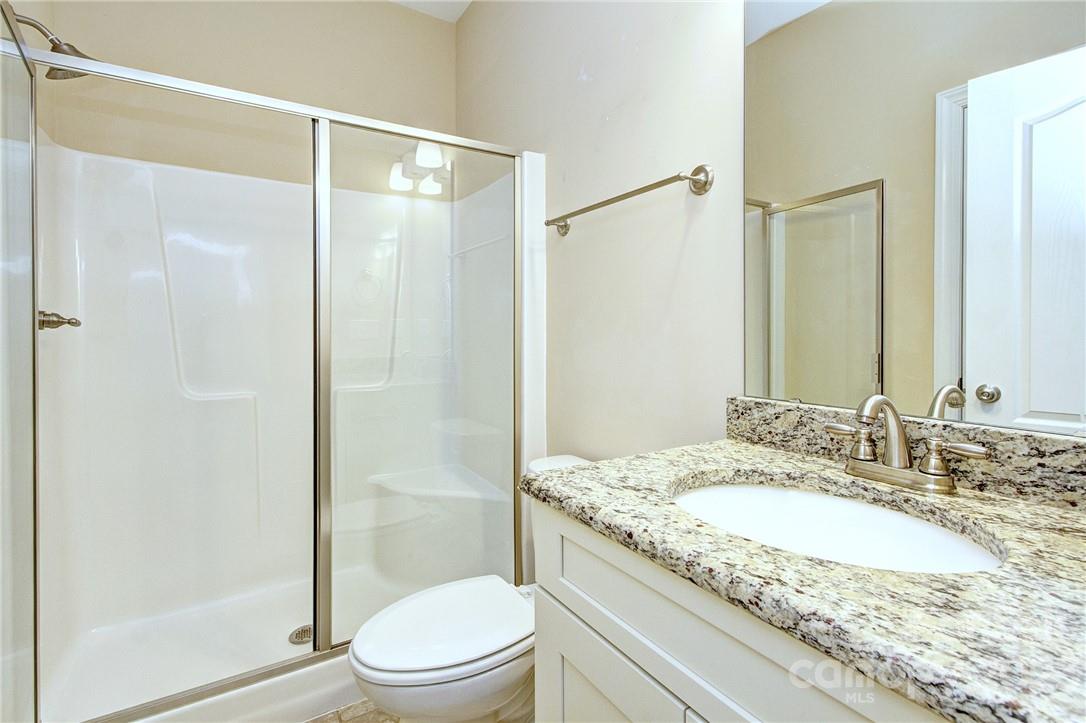 160 Kentmere Lane Clover, SC 29710 - Photo 17 of 37 a bathroom with a granite countertop sink toilet and shower