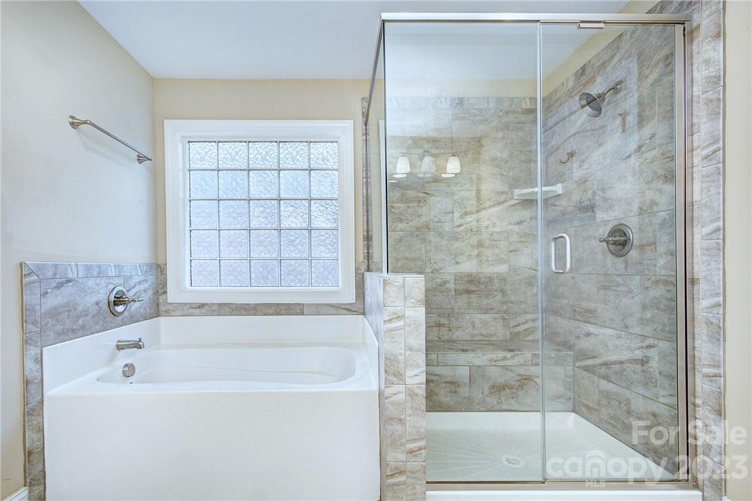 160 Kentmere Lane Clover, SC 29710 - Photo 21 of 37 a bathroom with a bathtub and a shower