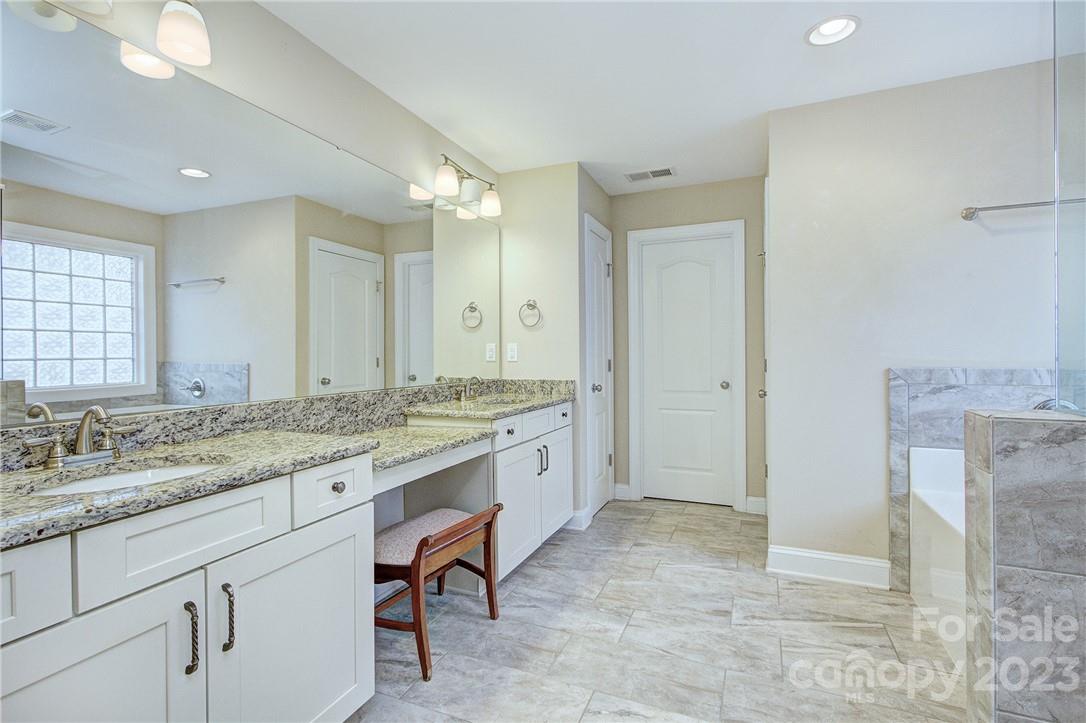 160 Kentmere Lane Clover, SC 29710 - Photo 22 of 37 a spacious bathroom with a granite countertop sink a mirror and a