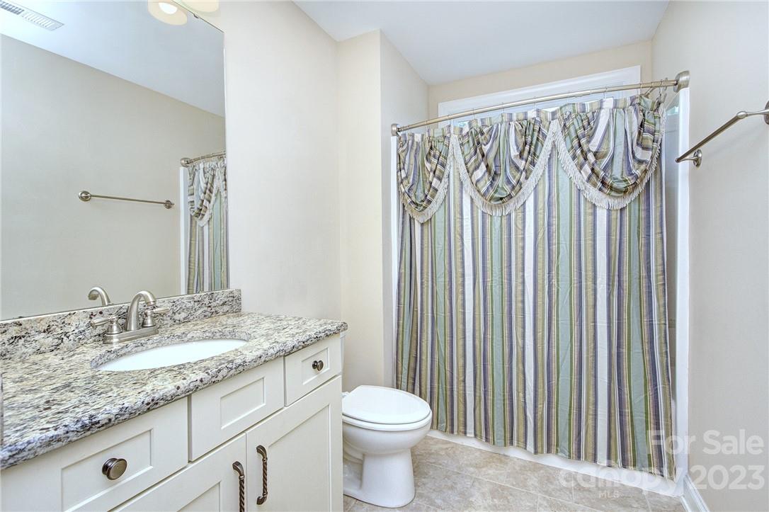 160 Kentmere Lane Clover, SC 29710 - Photo 28 of 37 a bathroom with a granite countertop sink a toilet and a mirror