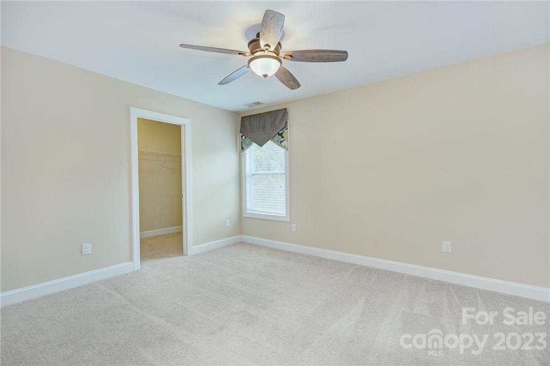 160 Kentmere Lane Clover, SC 29710 - Photo 29 of 37 an empty room with a ceiling fan and a window