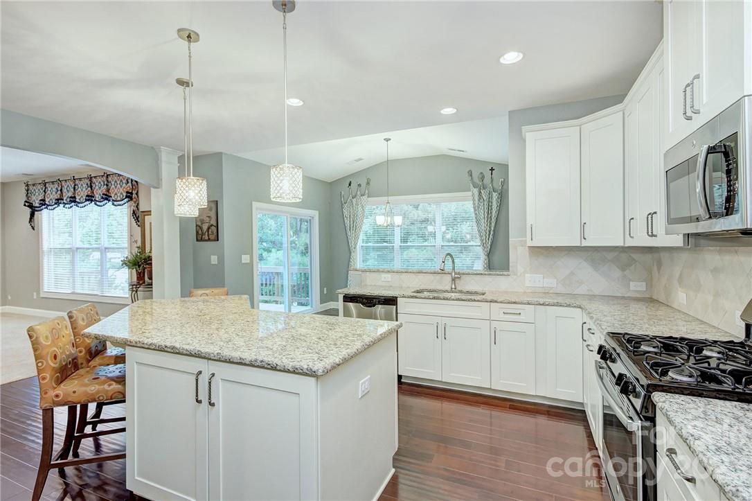 160 Kentmere Lane Clover, SC 29710 - Photo 7 of 37 a kitchen with stainless steel appliances granite countertop stove top oven and cabinets