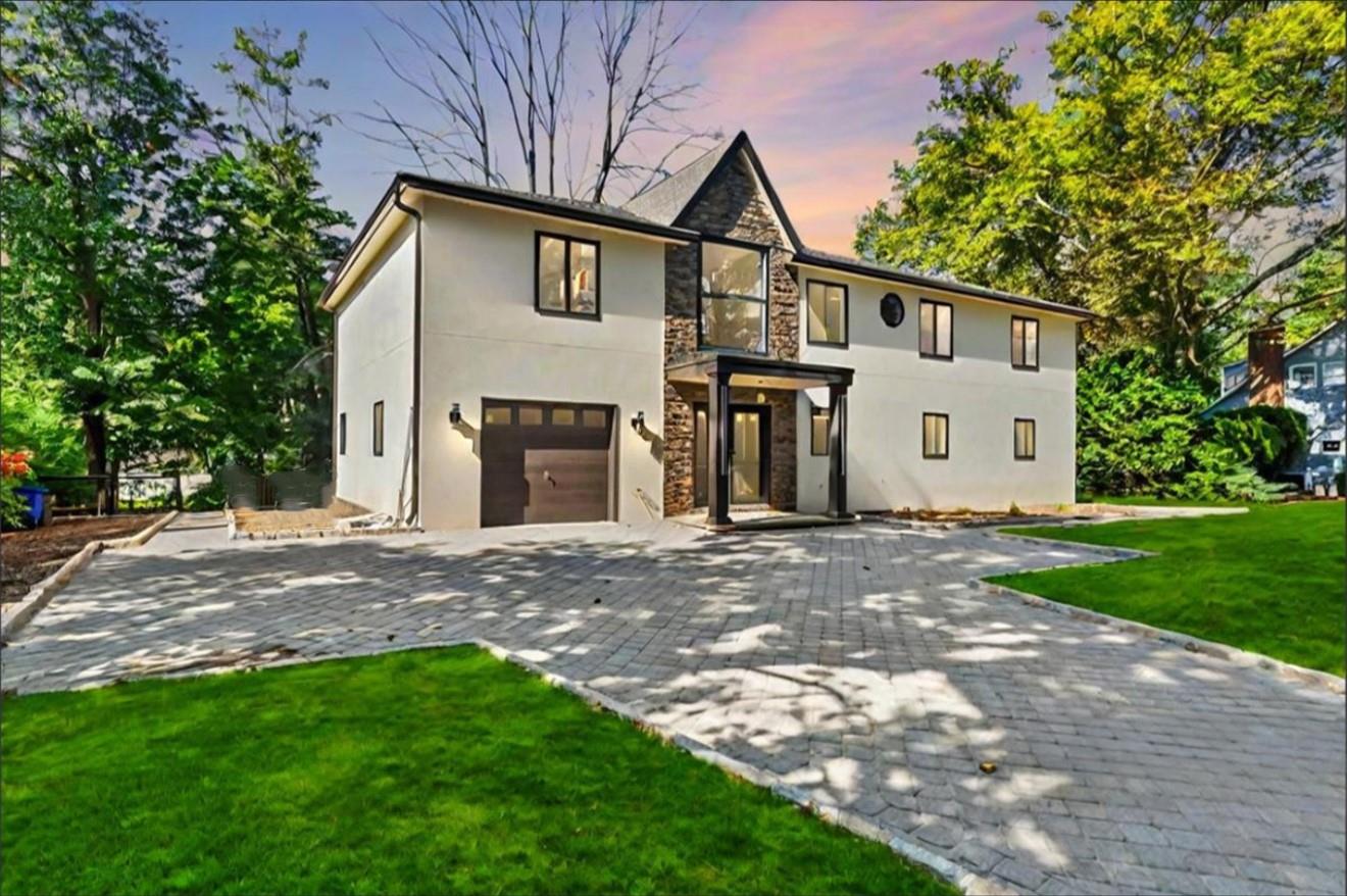 408 Wilmot Road New Rochelle, NY 10804 - Photo 1 of 1 View of front of home with a lawn and a garage. Virtually Enhanced