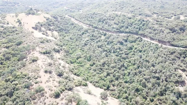 an aerial view of house with yard