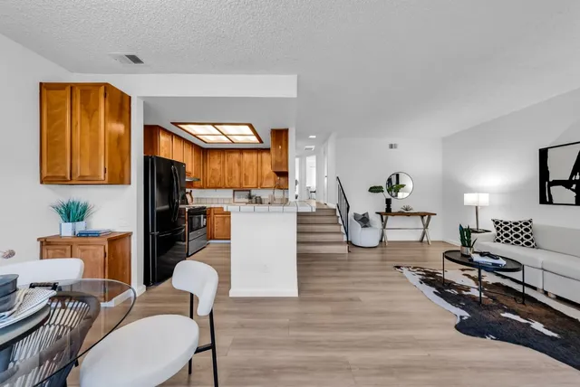 a dining room with furniture and window