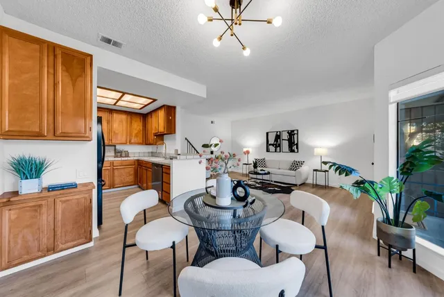 a dining room with furniture and window