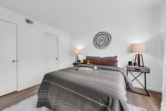 a bedroom with bed and a window