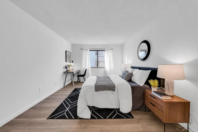 a spacious bathroom with a double vanity sink and a mirror