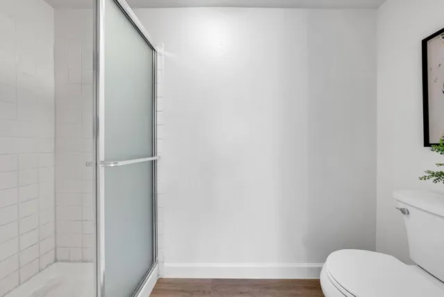 a front view of a house with porch and garden