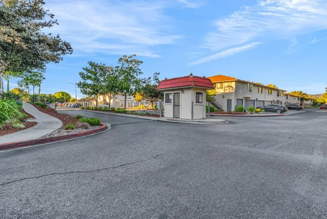 an aerial view of a house with a yard and swimming pool
