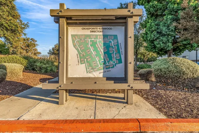 an aerial view of a house with a garden and swimming pool