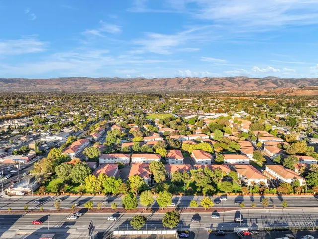 an aerial view of houses with yard