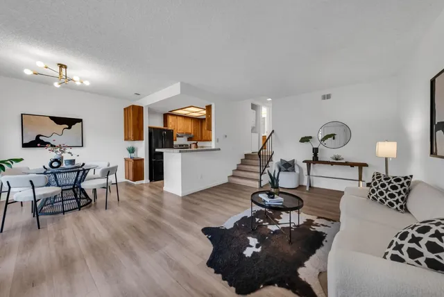 a living room with furniture and a lamp