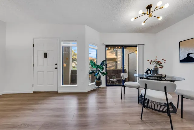 a view of a dining room with furniture window and wooden floor