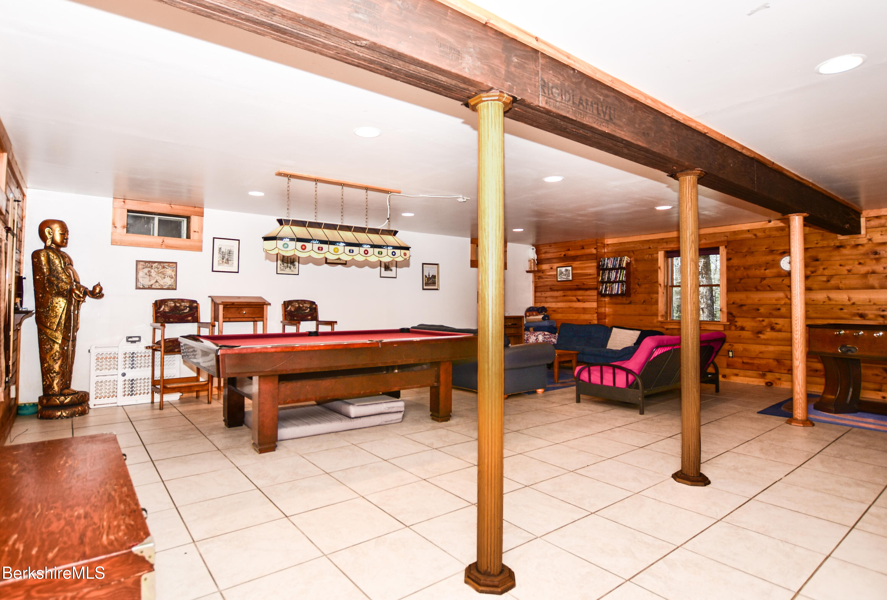 233 Algerie Road Becket, MA 01223 - Photo 37 of 48 a living room with lots of furniture and a table