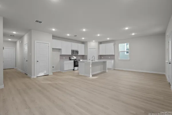 a view of kitchen with wooden floor