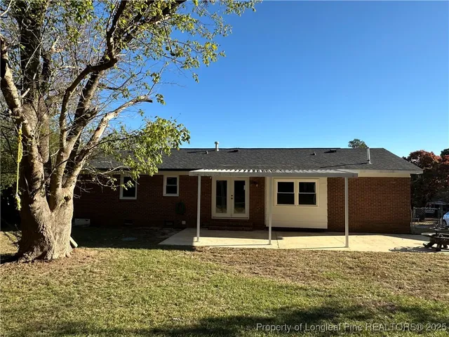 a house with trees in front of it