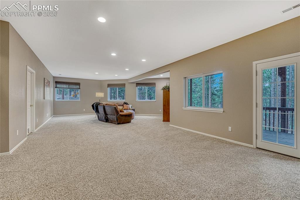 15585 Falcon Ridge Court Colorado Springs, CO 80921 - Photo 31 of 50 a living room with furniture and a large window