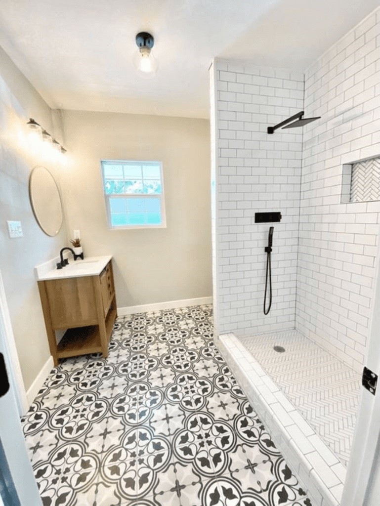 6716 Jefferson Boulevard Groves, TX 77619 - Photo 16 of 34 a bathroom with a sink toilet and shower