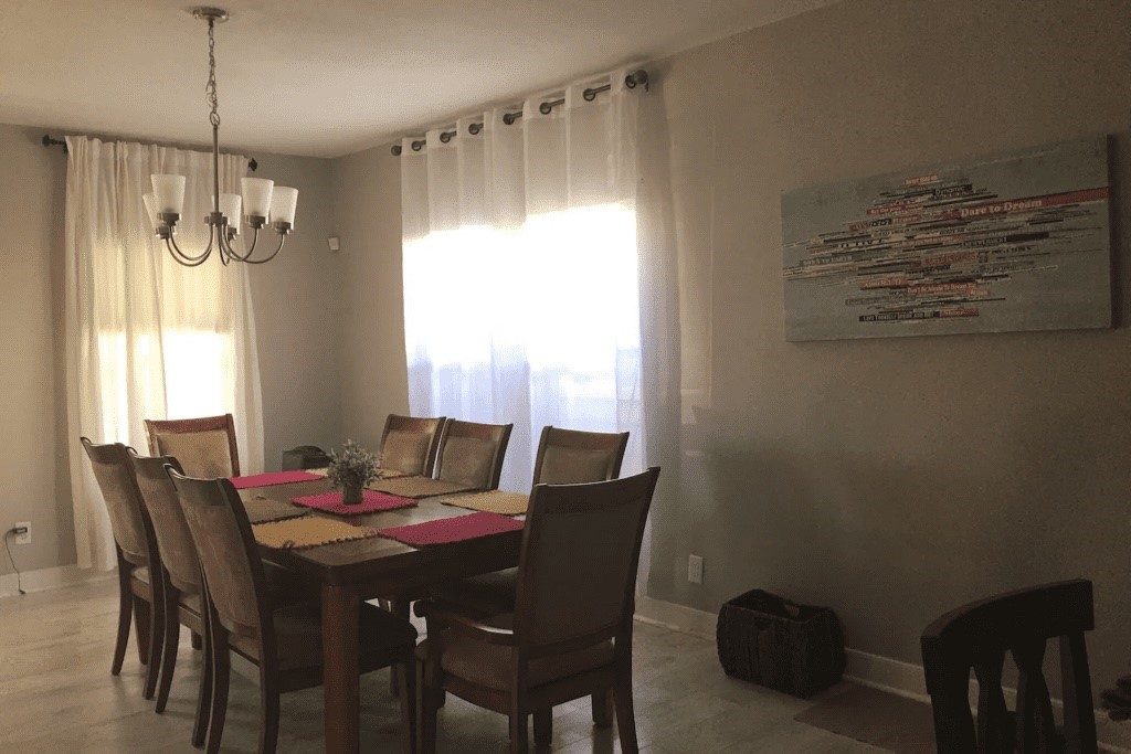 6716 Jefferson Boulevard Groves, TX 77619 - Photo 18 of 34 a view of a dining room with furniture window and outside view