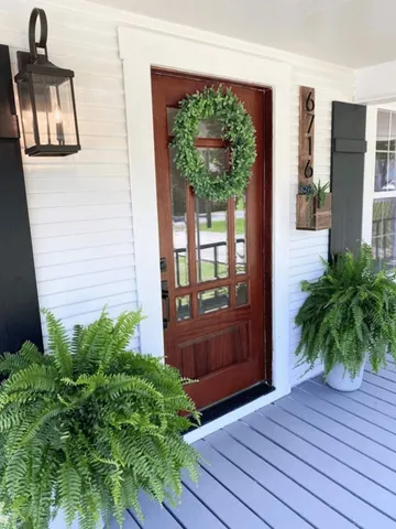 an empty room with balcony and outdoor space