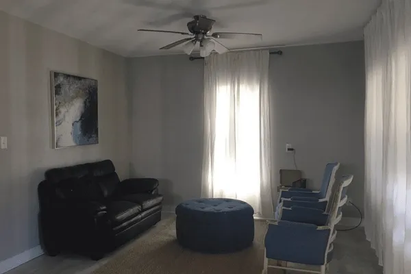 a living room with furniture and a window