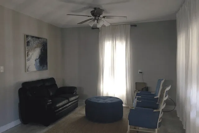 a living room with furniture and a window