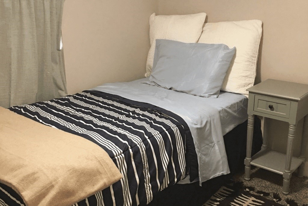 6716 Jefferson Boulevard Groves, TX 77619 - Photo 31 of 34 a bedroom with a bed and wooden floor