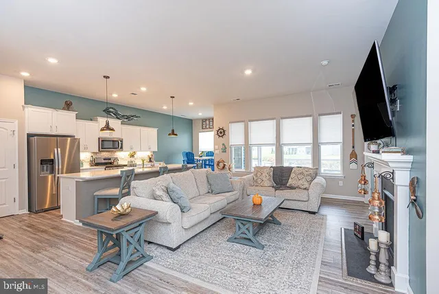 a living room with fireplace furniture and a flat screen tv
