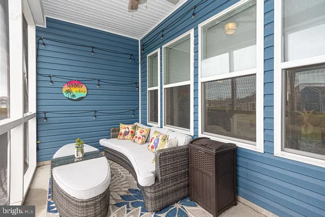 a balcony with table and chairs