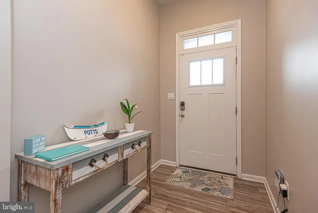 a room with a window and wooden floor