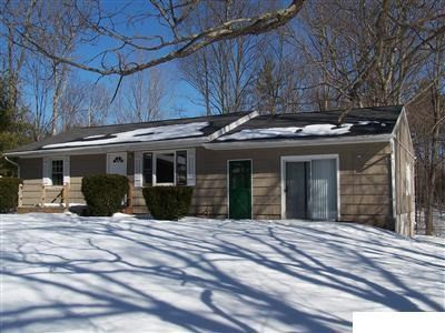 198 Vernal Butler Road Cairo, NY 12413 - Photo 1 of 1 a view of a house with a large window and wooden fence