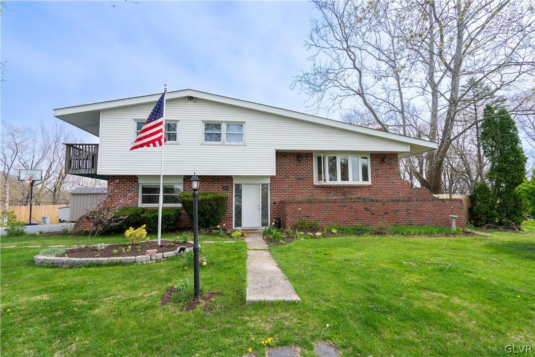 1234 Sunset Circle Slatington, PA 18080 - Photo 1 of 40 a front view of a house with a yard